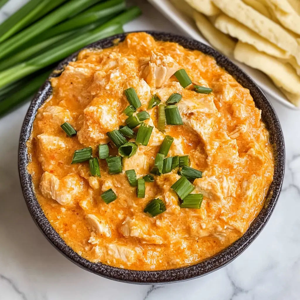 Warm up your gatherings with this easy Crockpot Buffalo Chicken Dip! This creamy, cheesy dip features a perfect blend of shredded chicken, tangy buffalo sauce, and melted cheese. Ideal for game day or cozy nights in, it’s a crowd-pleaser that pairs well with chips, celery, or crackers. Save this recipe to impress your friends and bring the heat to your next party!